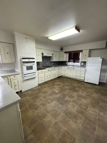 Cridersville apartment for rent - A kitchen with white cabinets and a tile floor.