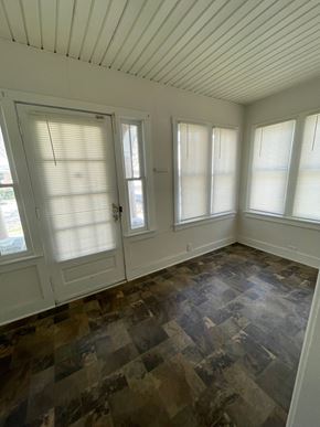 Cridersville apartment for rent - an empty room with three windows and a door