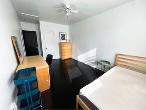 Baltimore apartment for rent - a bedroom with a bed and a desk in a room