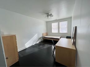 Baltimore apartment for rent - an empty room with a desk and a bed in it