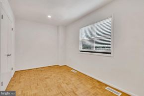Washington apartment for rent - a living room with a window and wooden floors