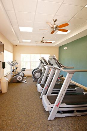 Orange apartment for rent - A row of treadmills in a gym.