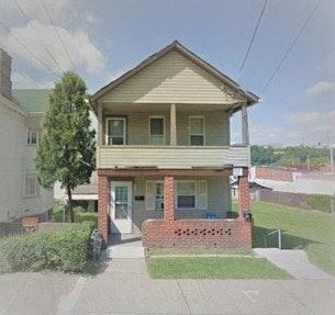 Glassport apartment for rent - a small house with a porch and a street in front of it
