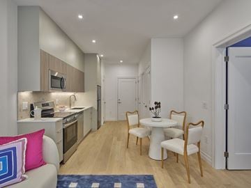 Philadelphia apartment for rent - a living room and kitchen with a table and chairs