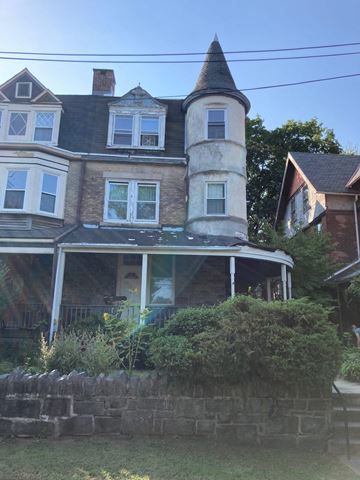 Philadelphia apartment for rent - a large house with a tower on top of it