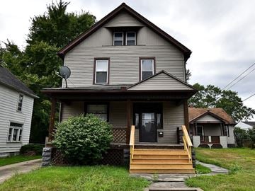 Niles house for rent - a house with a wooden porch and stairs