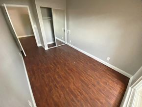 San Diego apartment for rent - a living room with a wooden floor and a closet