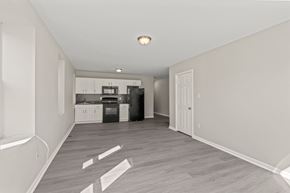 Philadelphia apartment for rent - A kitchen area with a refrigerator, oven, and microwave.