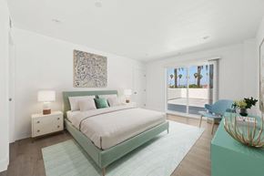 Los Angeles apartment for rent - a bedroom with a large bed and a window
