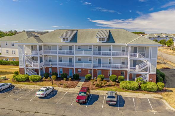 Myrtle Beach house for rent - an aerial view of an apartment building with cars parked in front of it