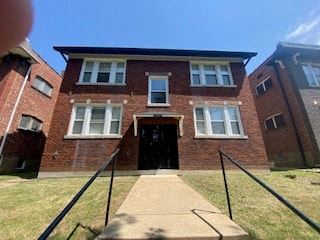 Saint Louis apartment for rent - the front of a brick building with an open door