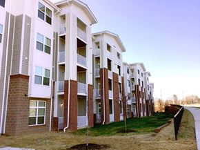 Charlotte apartment for rent - a row of apartments with balconies and grass