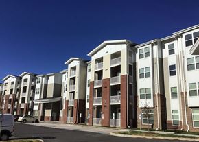 Charlotte apartment for rent - an apartment building with a blue sky in the background