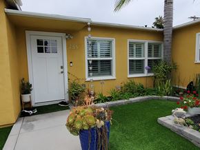 Imperial Beach house for rent - the front yard of a yellow house with a white door
