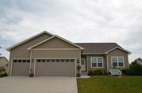 Ankeny house for rent - a house with a garage door and a driveway