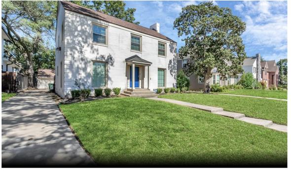 Houston house for rent - A white house with a blue door and windows is surrounded by a green lawn.