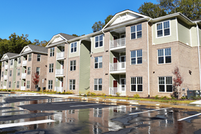 Clinton apartment for rent - Apartment building with a parking lot in front.