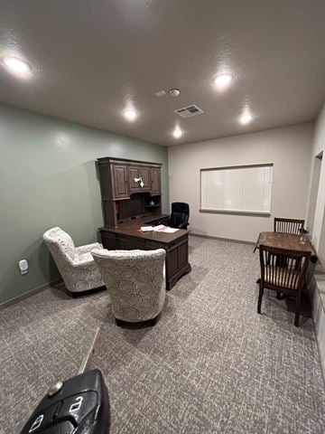 Caldwell apartment for rent - a small living room with a desk and chairs and a table