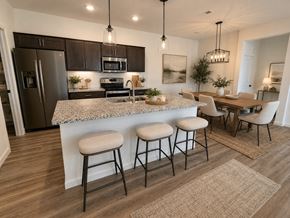Dodge City apartment for rent - A kitchen with a bar area and a dining table.