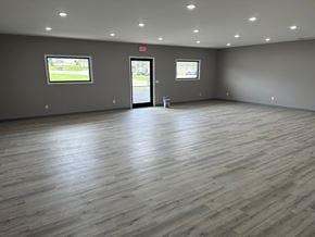 Bowling Green apartment for rent - a large room with wood floors and grey walls and a door