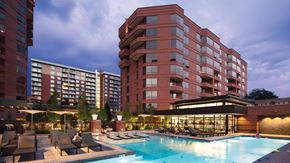 Denver apartment for rent - a swimming pool at a hotel in front of a building