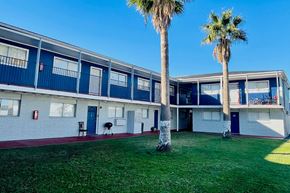 Pasadena apartment for rent - A row of houses with blue doors and windows.
