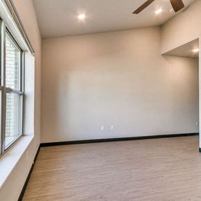 Ames apartment for rent - a living room with a large white wall and a window