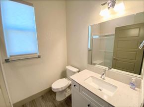 Merced house for rent - a bathroom with a sink toilet and a mirror