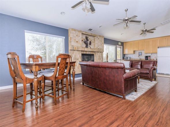 Rosamond apartment for rent - a living room with a table and a leather couch
