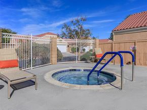 Rosamond apartment for rent - a small pool with a blue slide in a yard with a fence