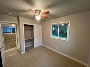 Fort Collins apartment for rent - A room with a ceiling fan and a window.