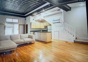 Columbus apartment for rent - an empty living room with a couch and a kitchen