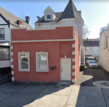 East Orange apartment for rent - a red building with a white house on top of it
