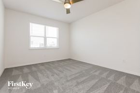 Bartow house for rent - the living room of a home with white walls and a window
