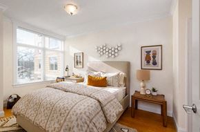 Brookline apartment for rent - A bedroom with a large bed and a window.