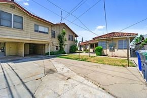 Fresno apartment for rent - an empty driveway in front of two houses