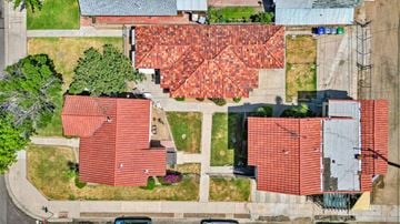 Fresno apartment for rent - an aerial view of a neighborhood with red roofs and grass