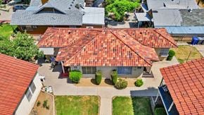 Fresno apartment for rent - an aerial view of a house with a red roof