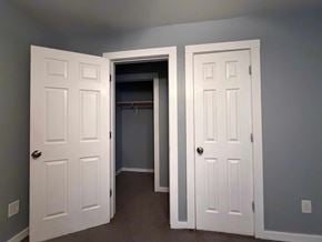 East Point apartment for rent - A room with two white doors, one open to a hallway.