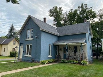 North Mankato apartment for rent - a blue house with a yard and a yellow house