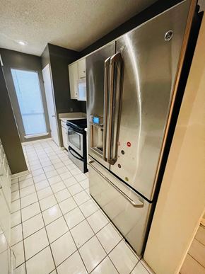 Lafayette house for rent - A stainless steel refrigerator with a digital display and a water and ice dispenser.