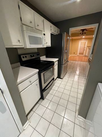 Lafayette house for rent - A kitchen with white appliances and black counter tops.