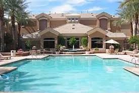 Phoenix apartment for rent - a large swimming pool in front of a resort building
