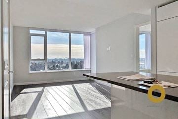 Richmond house for rent - a living room with a large window and a table