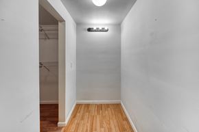 Fremont house for rent - a room with white walls and wood floors and a closet