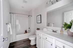 Lima apartment for rent - a white bathroom with a shower and a toilet and a sink