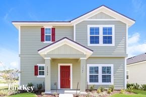 Yulee house for rent - a beige house with a red door