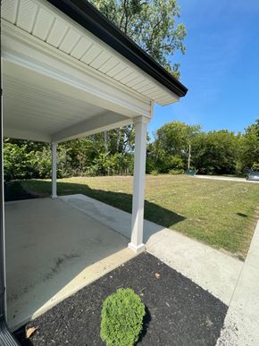 Lima apartment for rent - a covered patio with grass and trees in the background