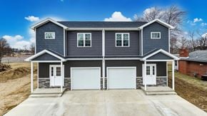 Elida apartment for rent - A two-story house with a garage and a driveway.