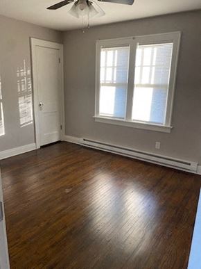 Lima house for rent - a living room with a hard wood floor and two windows